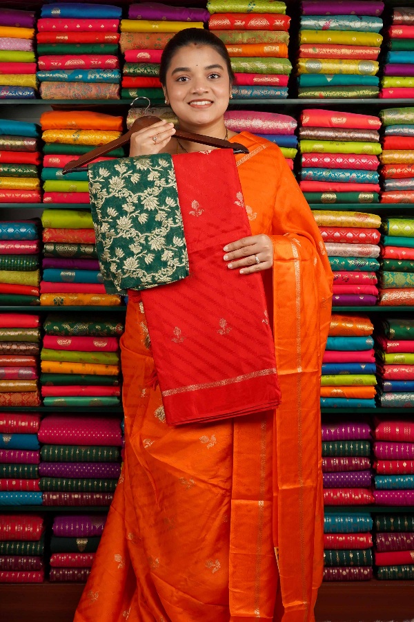 Crepe Silk Emboose Weaving With Zari Butti Red And Green Saree