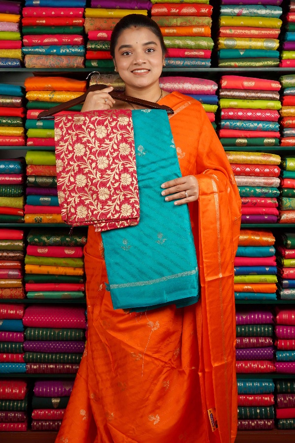 Crepe Silk Emboose Weaving With Zari Butti Coppersulphate Blue And Pink Saree